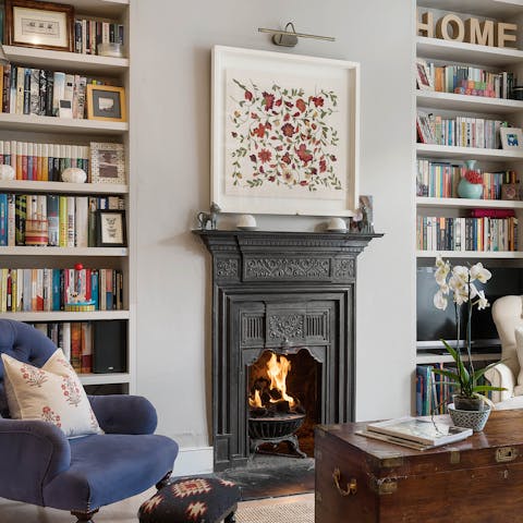 Pluck a book off the shelf and enjoy reading by the crackling fire