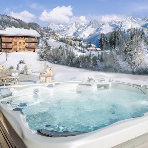 Soak tired muscles in the private hot tub at the end of a busy day