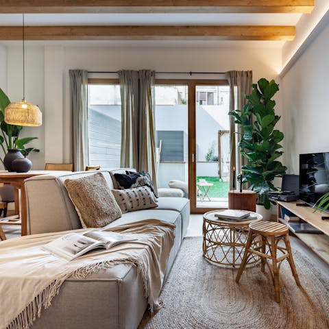 Kick back in the bright living room with a glass of Spanish wine after a day of exploring