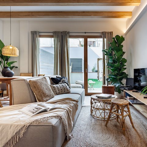 Kick back in the bright living room with a glass of Spanish wine after a day of exploring
