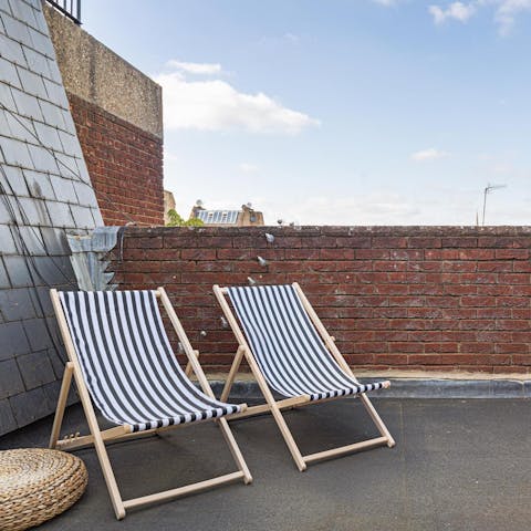 Bask in the summer sunshine on the private roof terrace
