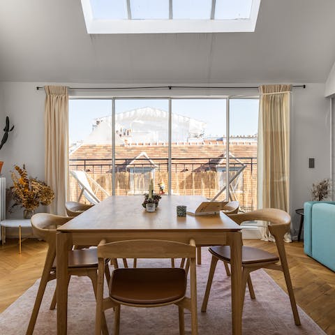 Marvel at the rooftop view from the dining table