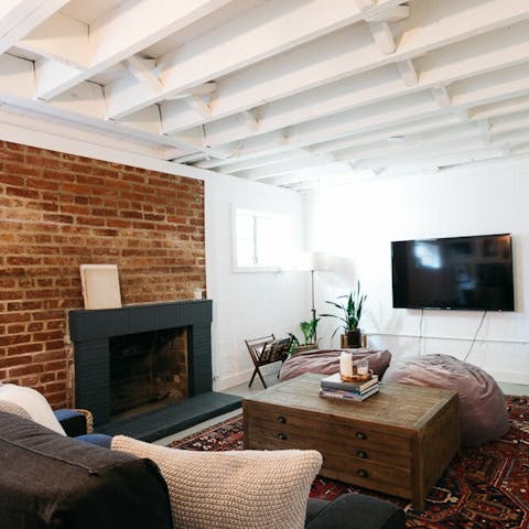 Cuddle up by the open fireplace in the TV room