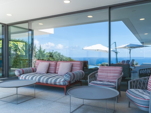 Unwind with drinks in the shade of the veranda