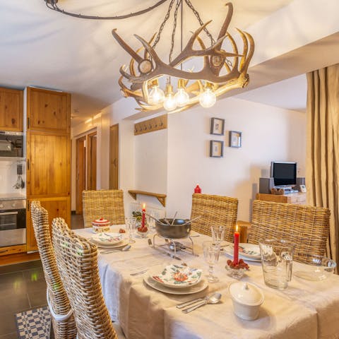 Indulge in a fondue dinner underneath the antler chandelier