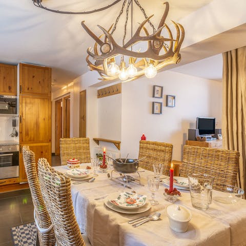 Indulge in a fondue dinner underneath the antler chandelier