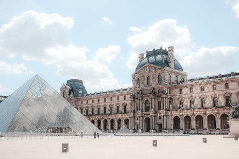 Visit the iconic Louvre Museum, a short walk away