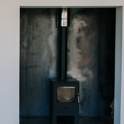 Warm up by the wood burning fire after a dip
