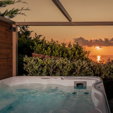 Watch the sunset from the private Jacuzzi
