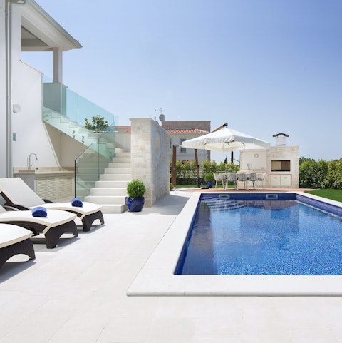 Relax in the Croatian sun by the pool