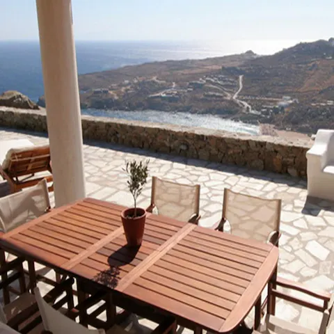 Dine outdoors and look down at Super Paradise Beach below