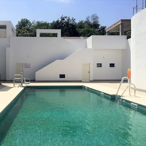 Enjoy a refreshing swim in your communal swimming pool