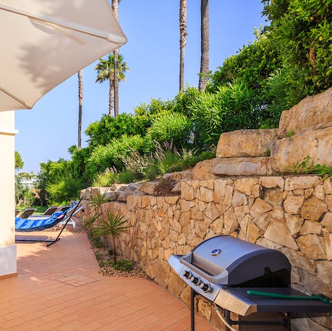 Fire up the barbecue and enjoy cooking on the shaded terrace
