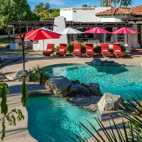 Stretch out by the lagoon-style swimming pool