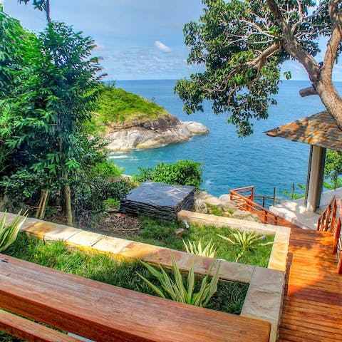 Gaze out at the balmy sea views from your elevated hillside position overlooking the Andaman Sea