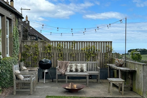 Fire up the barbecue under festoon lights with open views