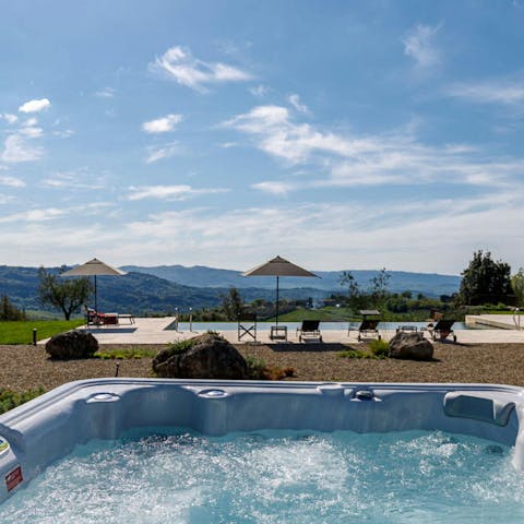 Admire the scenery while unwinding in the hot tub