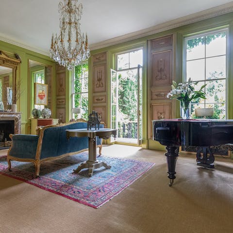 Feel a sense of grandeur in the living room, boasting a piano