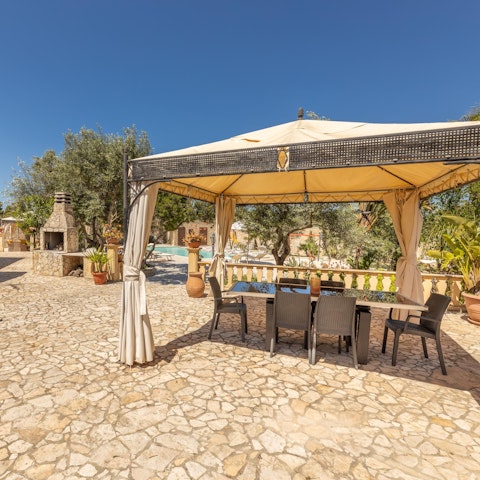 Cook fresh seafood on the barbecue and dine under the pergola