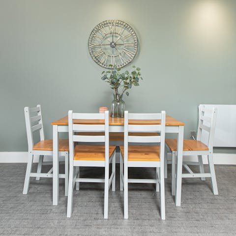 Sit down to a celebratory meal at the farmhouse-style dining table