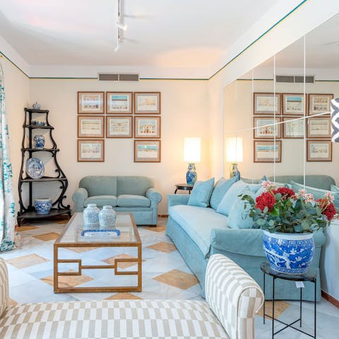 Gather together in the traditional-style living room adorned with trinkets