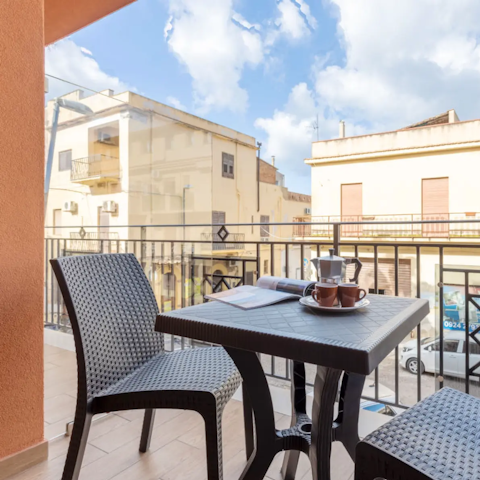 Sip your morning coffee on the private balcony
