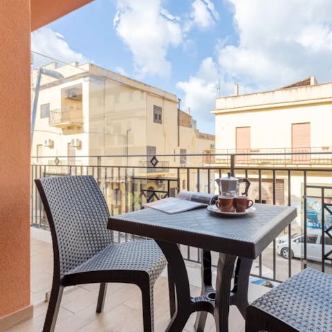 Sip your morning coffee on the private balcony