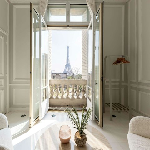Wake up to Eiffel Tower views in the main bedroom