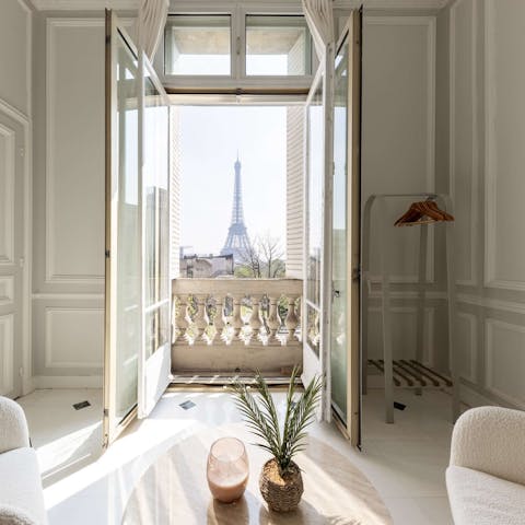 Wake up to Eiffel Tower views in the main bedroom