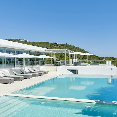 Float gracefully about the infinity pool before retiring to the hot tub