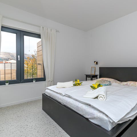 Wake up to mountain views in the comfortable main bedroom