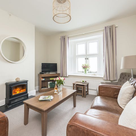 Curl up around the fire after a brisk coastal walk