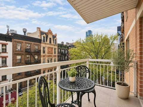Step out onto the balcony overlooking the neighbourhood