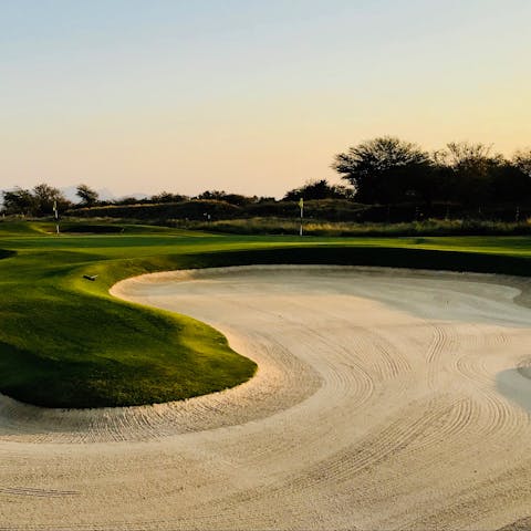 Pot an ace at the Atalaya Golf & Country Club, a short drive away