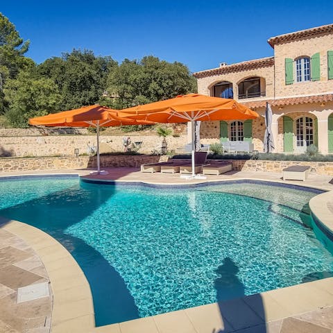 Spend all afternoon lounging by the pool, moving only to top up your glass