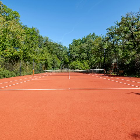 Practise your serve on the private tennis court