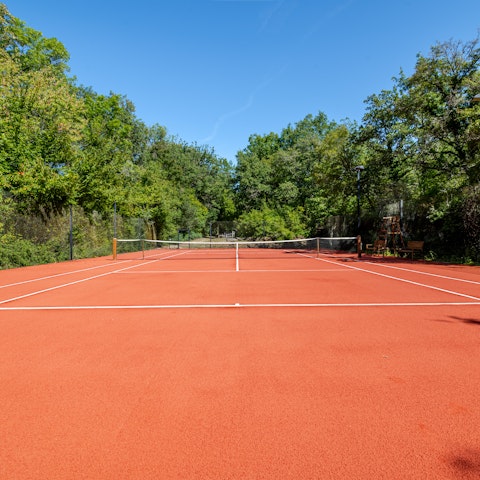 Practise your serve on the private tennis court