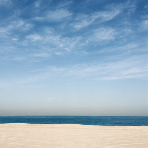 Sink your toes into the sands of JBR beach, a few minutes' walk from your apartment