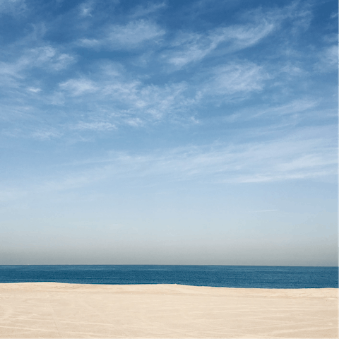 Sink your toes into the sands of JBR beach, a few minutes' walk from your apartment