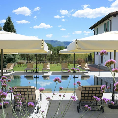 Soak in views of Valdarno's Balze Cliffs from the poolside