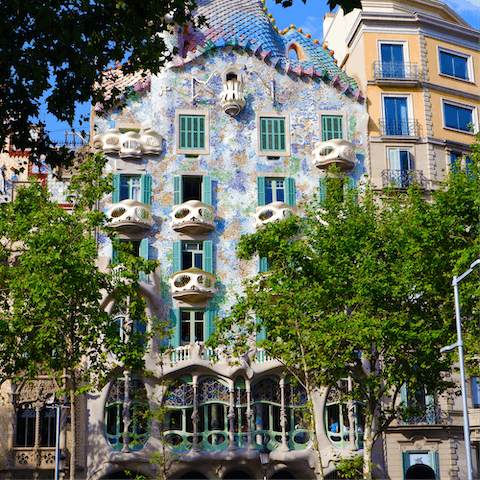 Marvel at Casa Batlló, a thirteen-minute walk away
