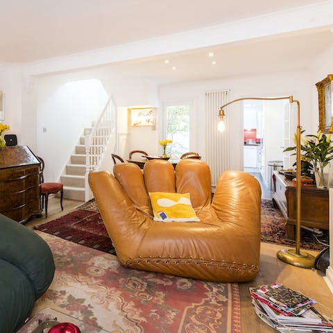 Sink into the quirky hand-shaped chair after a long day