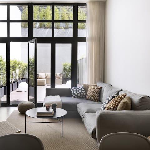 Relax on the L-shaped sofa while you nibble olives and Catalan cheeses