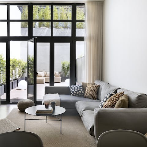 Relax on the L-shaped sofa while you nibble olives and Catalan cheeses