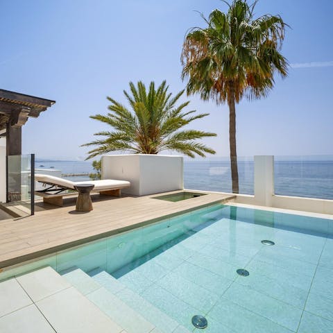 Admire the view from the picturesque pool