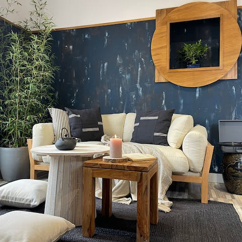 Kick back in the stylish living room with a glass of Spanish wine while listening to some tunes on the record player