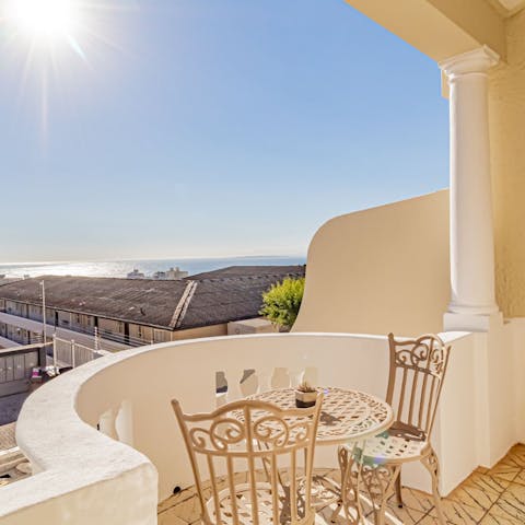 Enjoy views over the glistening bay and Robben Island from your private balcony