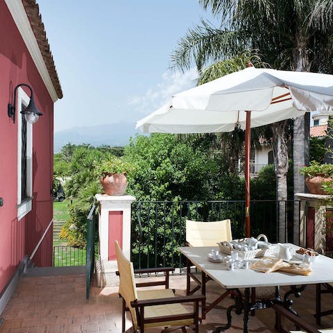 Dine out on the terrace with a beautiful view of the island's famous volcano