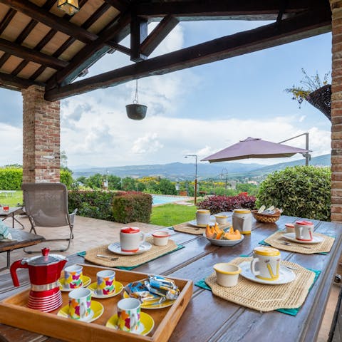Sit down to an alfresco meal while watching the sun set behind the hills
