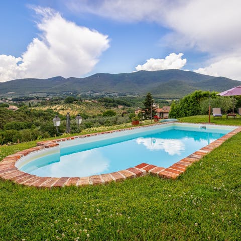 Lounge by the pool while enjoying views of Umbria's beautiful countryside